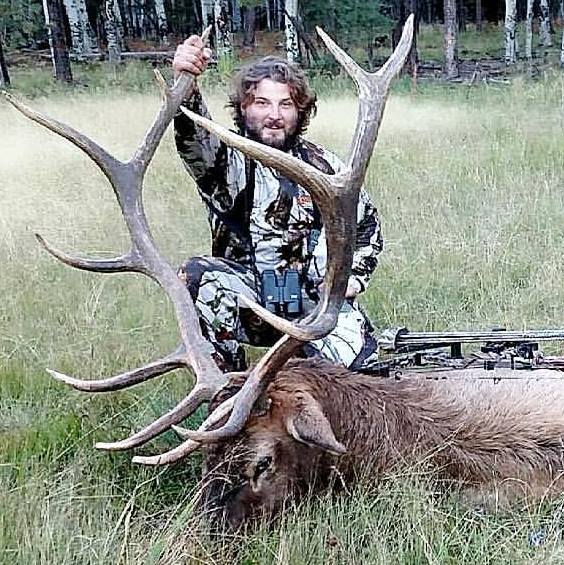 Kyle Mathews with dead deer